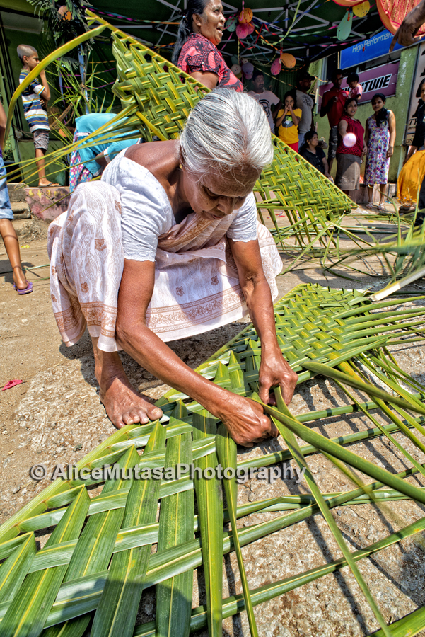 Lokumenike - competing in a womens' coconut leaf weaving contest (don't ask..!) she came last ...