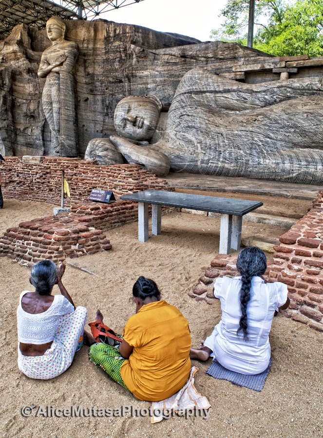 Prayers by the big Buddha, Polonaruwa