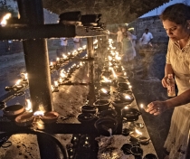 Candle offerings at the Temple of the Tooth, Kandy, evening 'Vesak' full moon puja for the Buddha's birthday