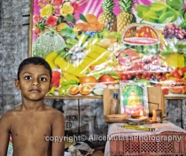 Bosith in his father's fruit & vegetable shop