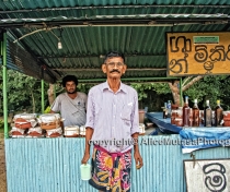 I didn't manage to get his name; I think he is the owner of this roadside bar selling 'curd' - delicious home-made yoghourt