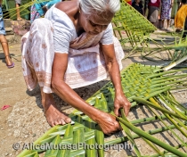 Lokumenike - competing in a womens' coconut leaf weaving contest (don't ask..!) she came last ...