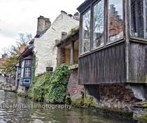 Canal view with tourist-filled bridge