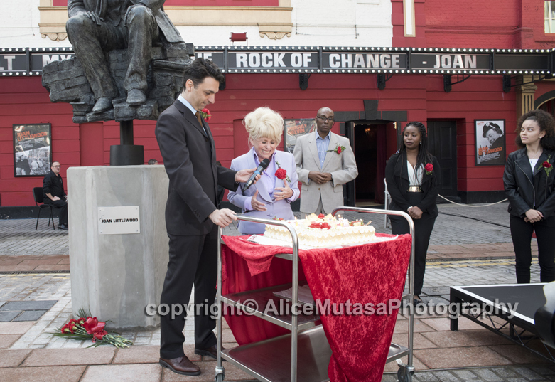 Barbara cutting the birthday cake for Joan Littlewood