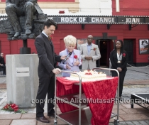Barbara cutting the birthday cake for Joan Littlewood