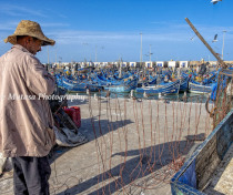 Hussein - doing something with some string at the port