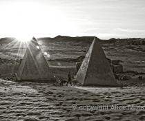 Sunrise with workman - restored pyramids at Meroë