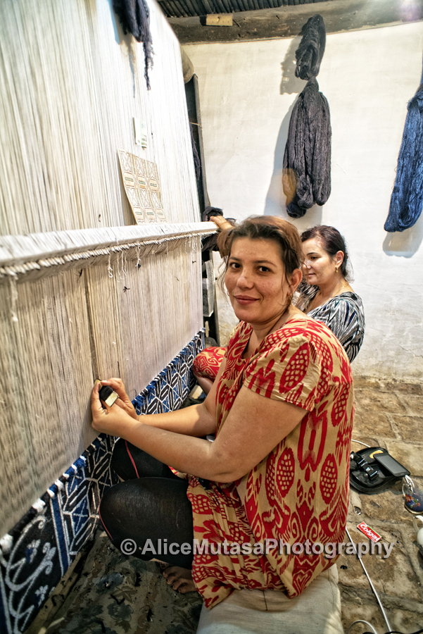 Nargiza weaving a silk carpet