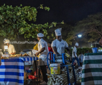 Making sugar cane juice; Forodhani night food market. Stone Town.