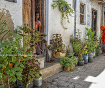 Wahida and her fabulous plant collection outside her house in Stone Town